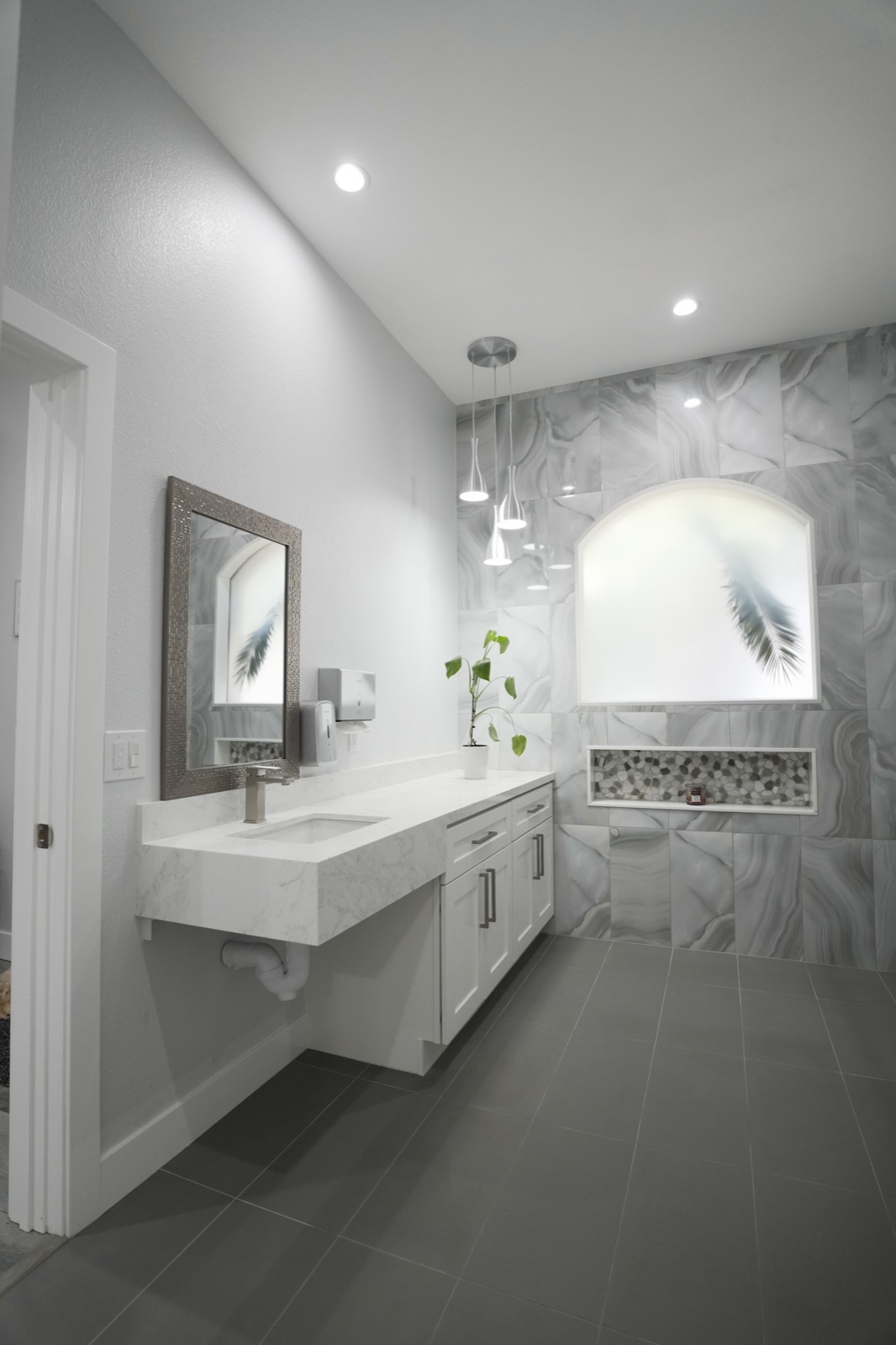 An accessible bathroom with a wide vanity and mirror