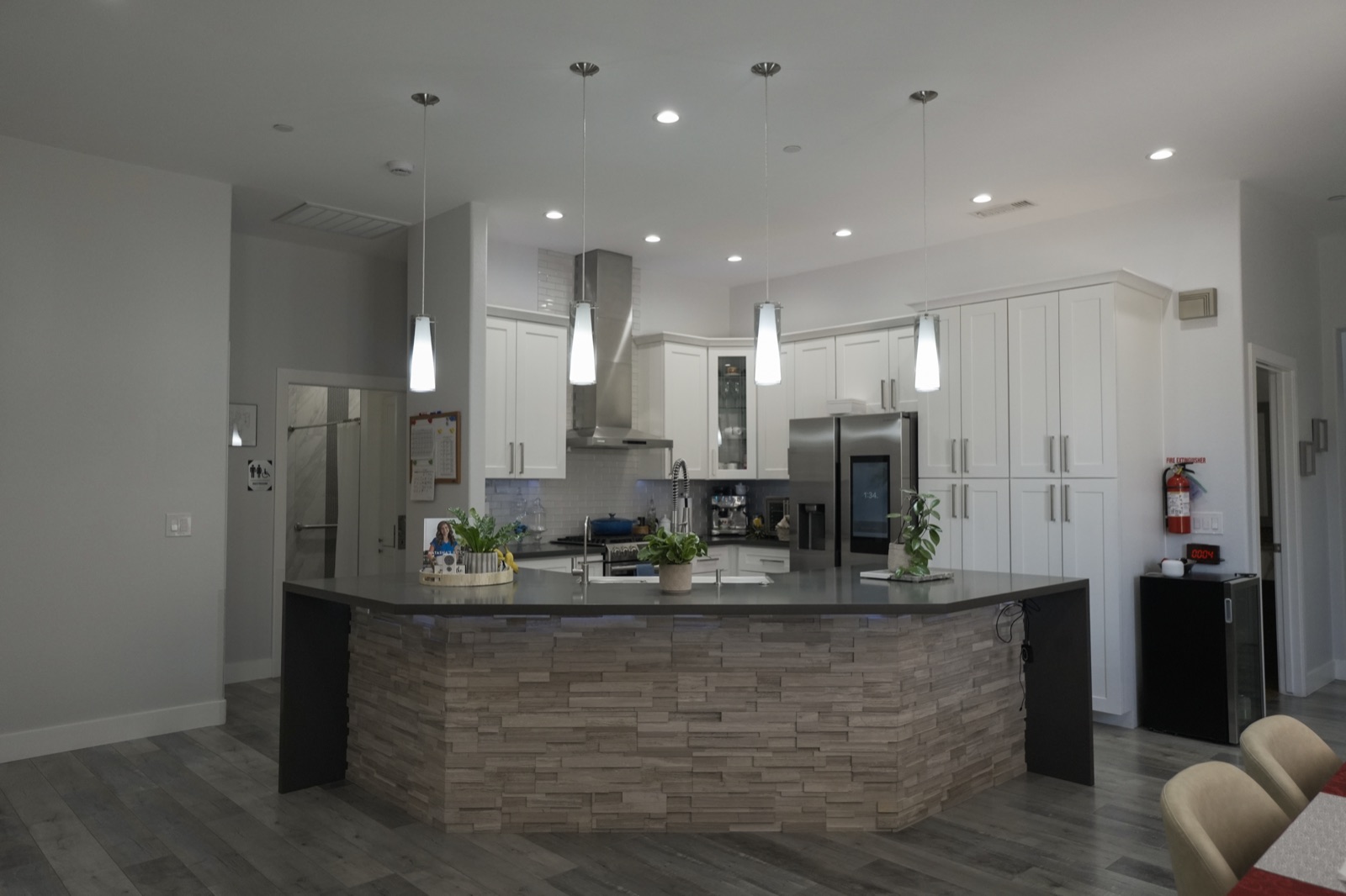A modern kitchen with a stone island