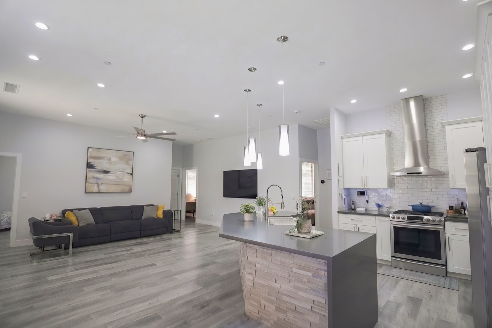 The open great room and kitchen, filled with natural light